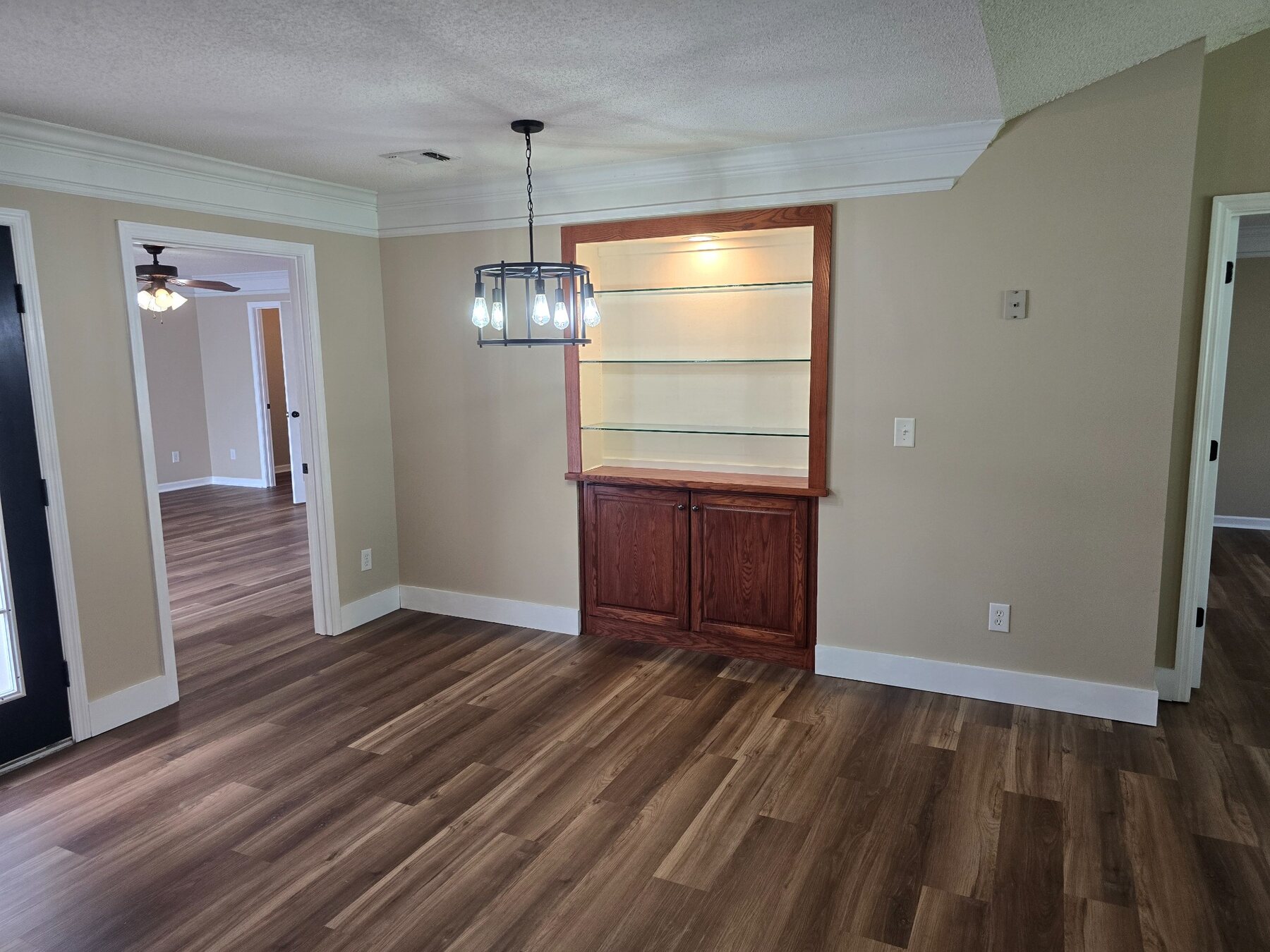Dining area with pendant light and built-in display cabinet