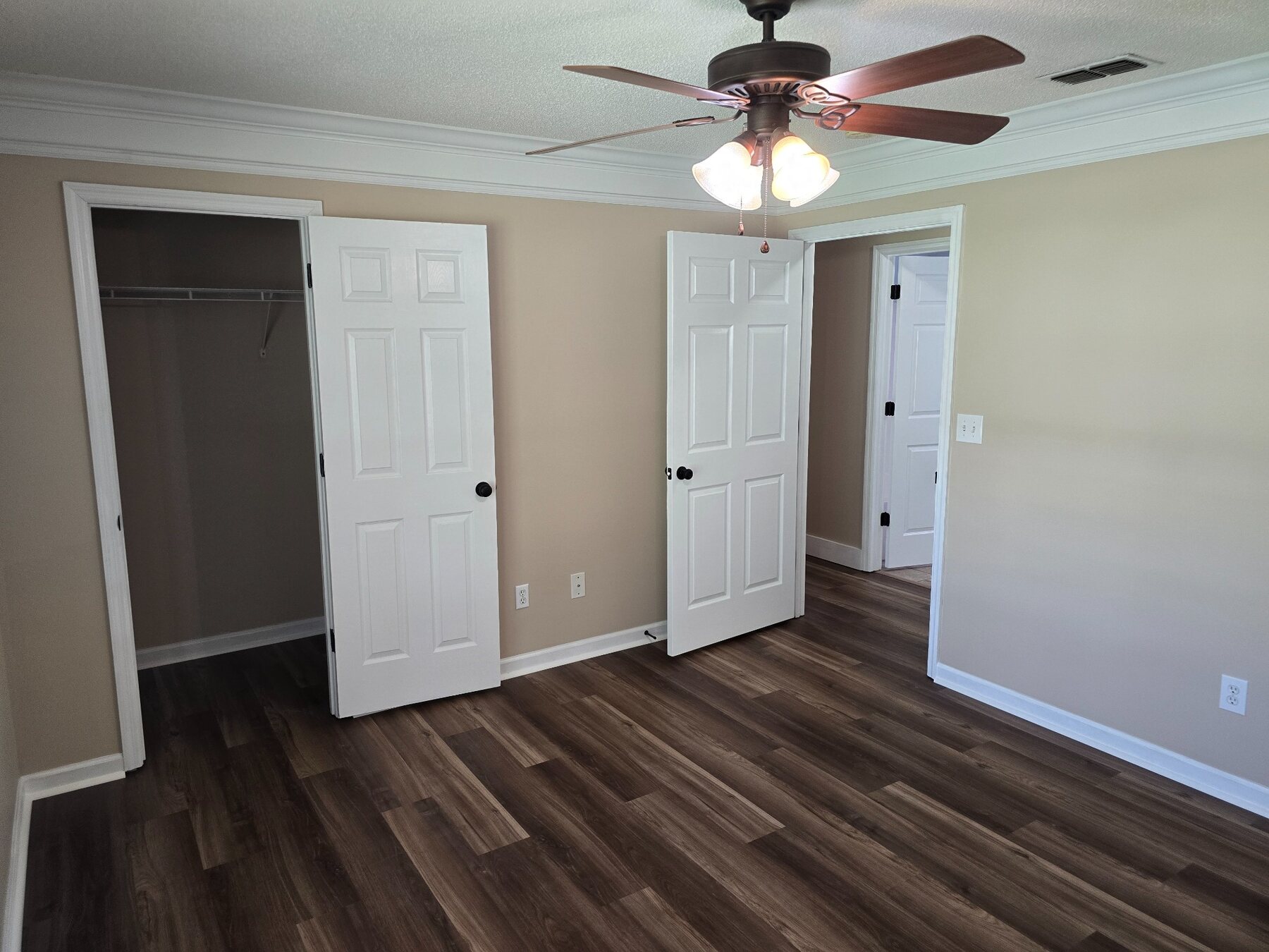 Bedroom with two closets and adjoining doorway