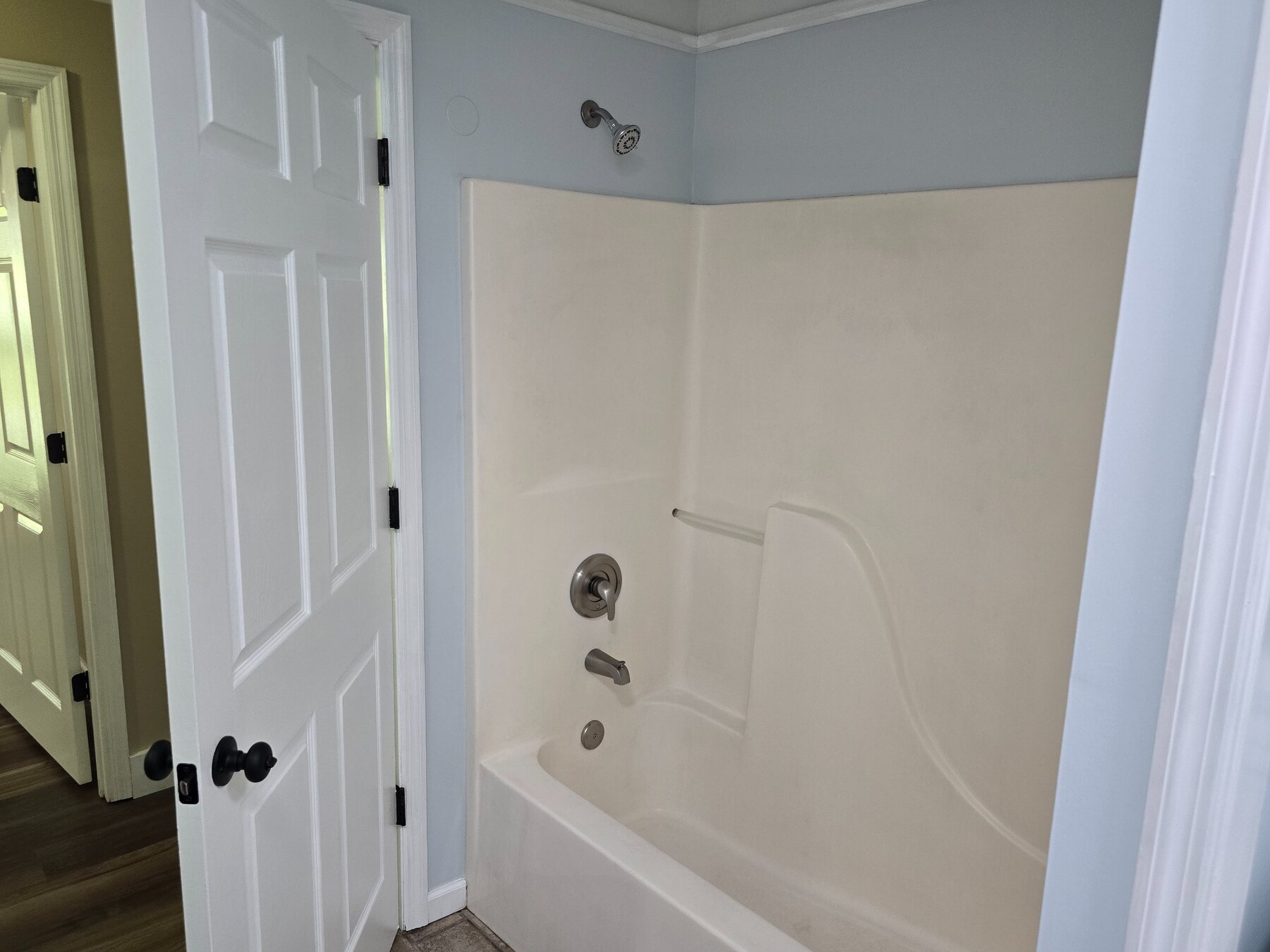 Bathroom with tub and shower combination