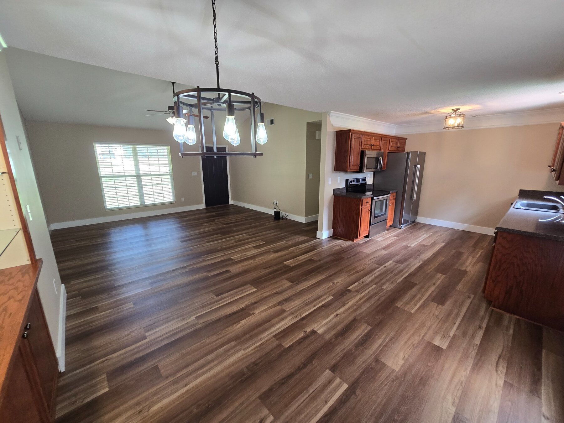 Open dining and kitchen area with pendant lighting