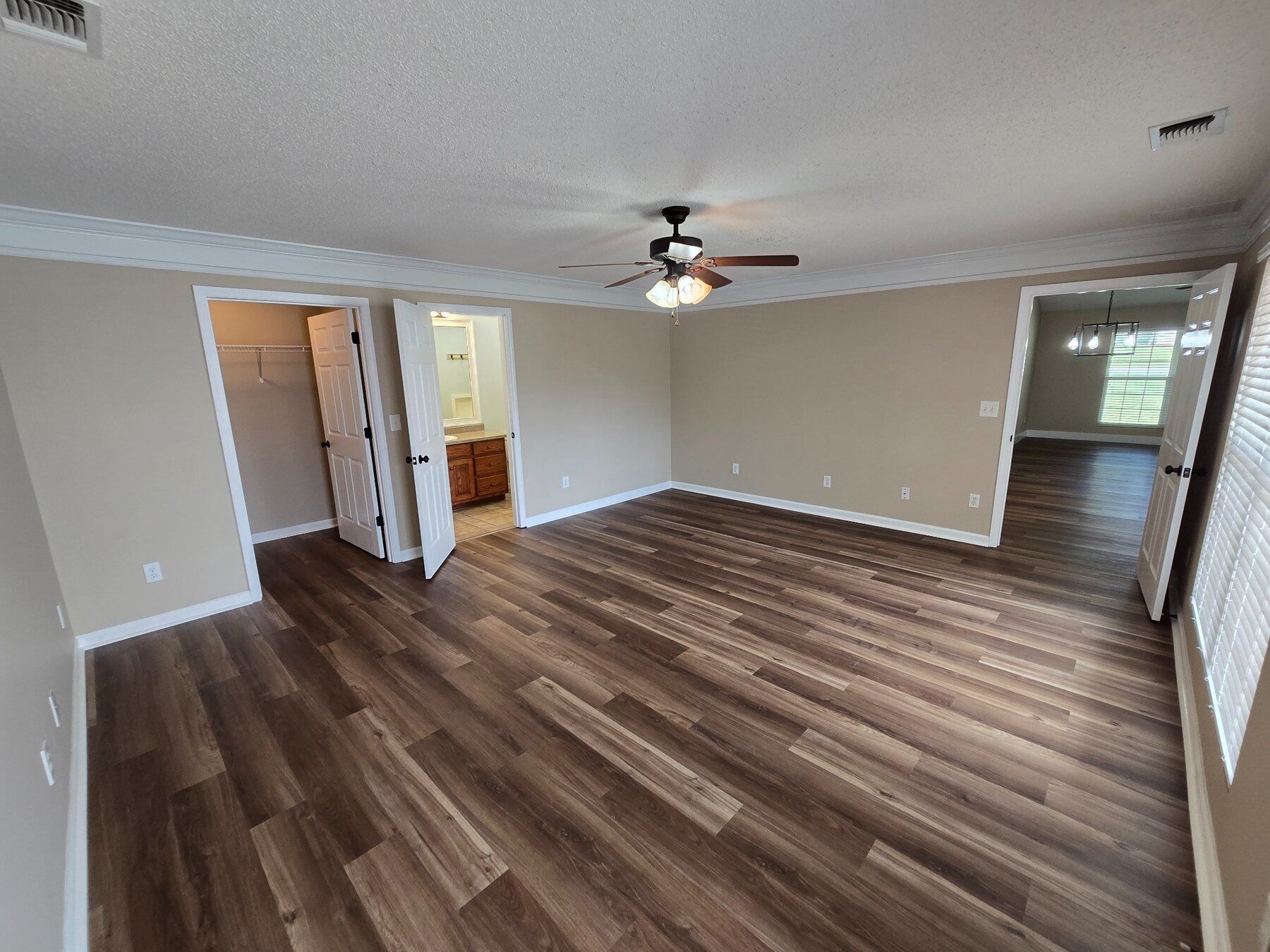 Alternate view of a large bedroom and adjoining doorway